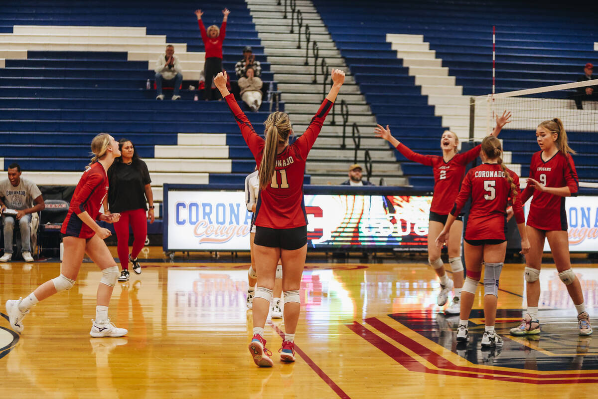 The Coronado girls volleyball team celebrates winning a match against Shadow Ridge during a Cla ...