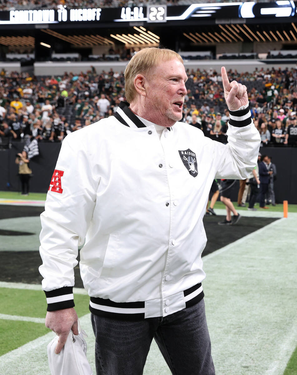 Raiders owner Mark Davis chats on the sidelines before facing the Green Bay Packers during the ...