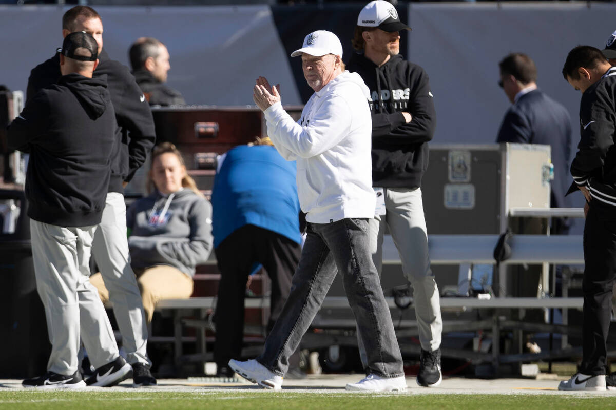 Raiders owner Mark Davis claps for the team during warm ups before an NFL game against the Chic ...