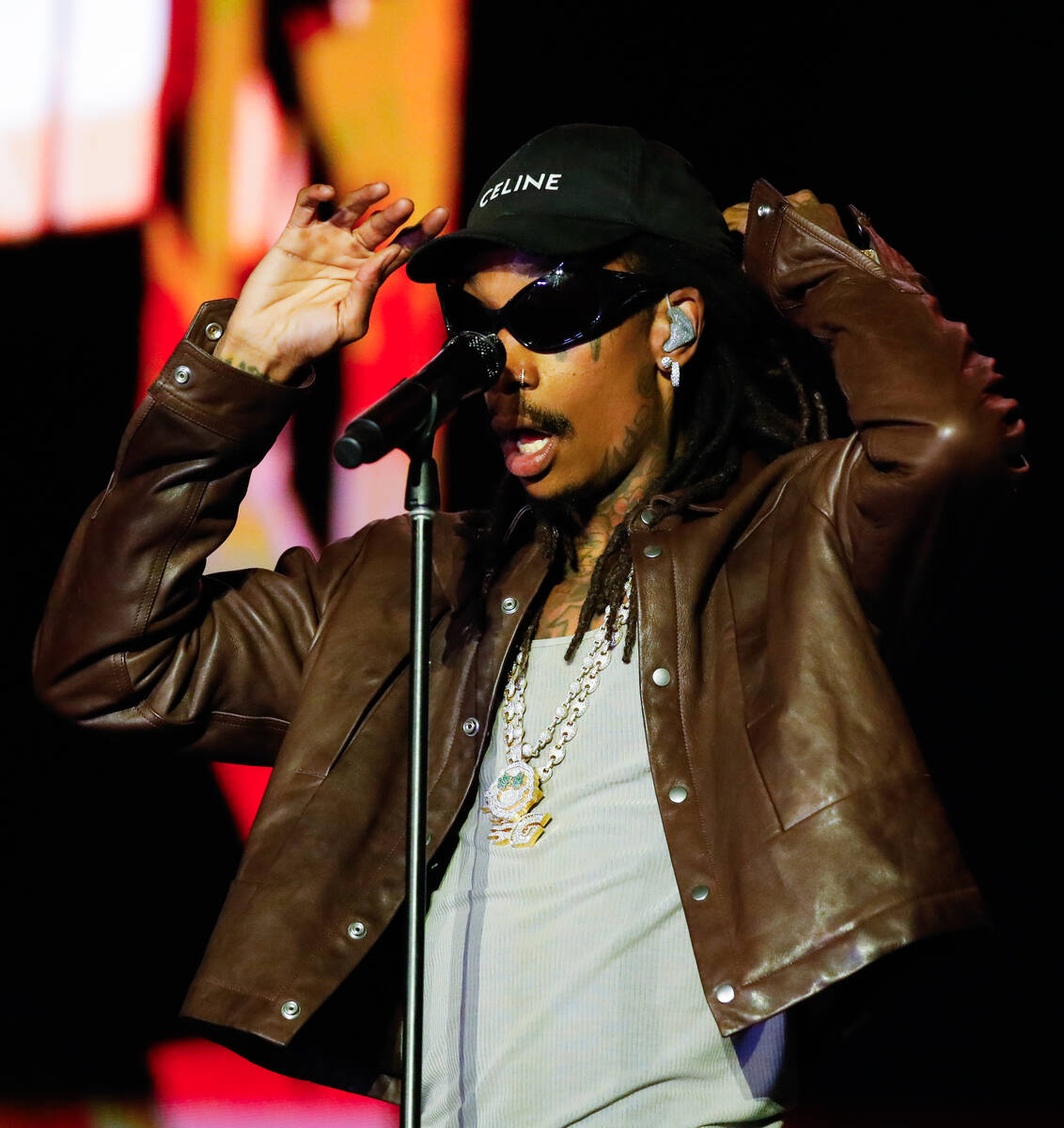 Wiz Khalifa adjusts his hat during a performance at the 2023 SEMA Fest on Friday, Nov. 3, 2023 ...