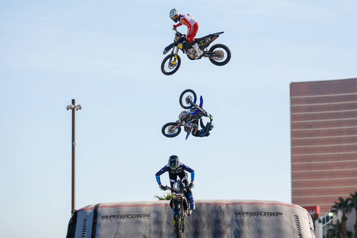 James Carter, from top, Jarryd Mcniel, and Keith Sayers perform a series of tricks together dur ...