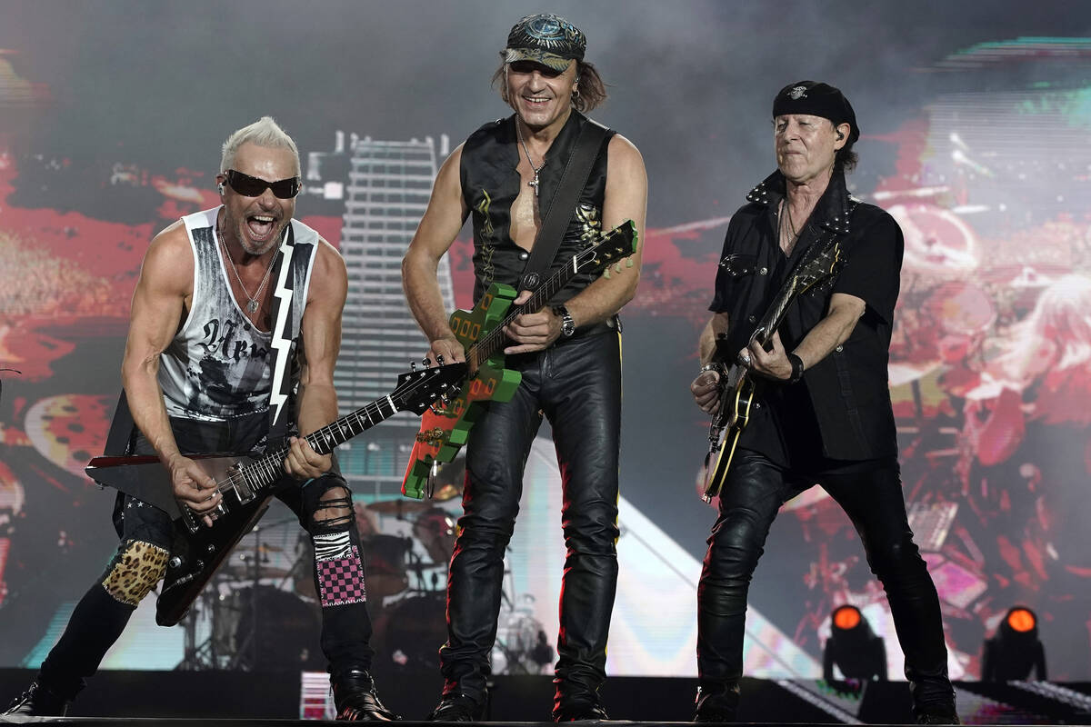 Rudolf Schenker, from left, Matthias Jabs and Klaus Meine, of the band Scorpions perform at the ...