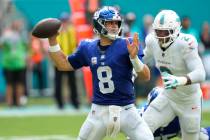 New York Giants quarterback Daniel Jones (8) aims a pass during the second half of an NFL footb ...