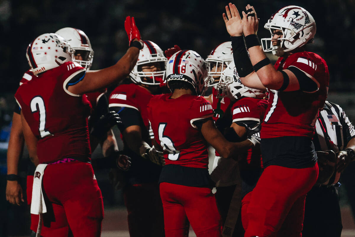 Liberty players celebrate another touchdown during a game against Shadow Ridge at Liberty High ...