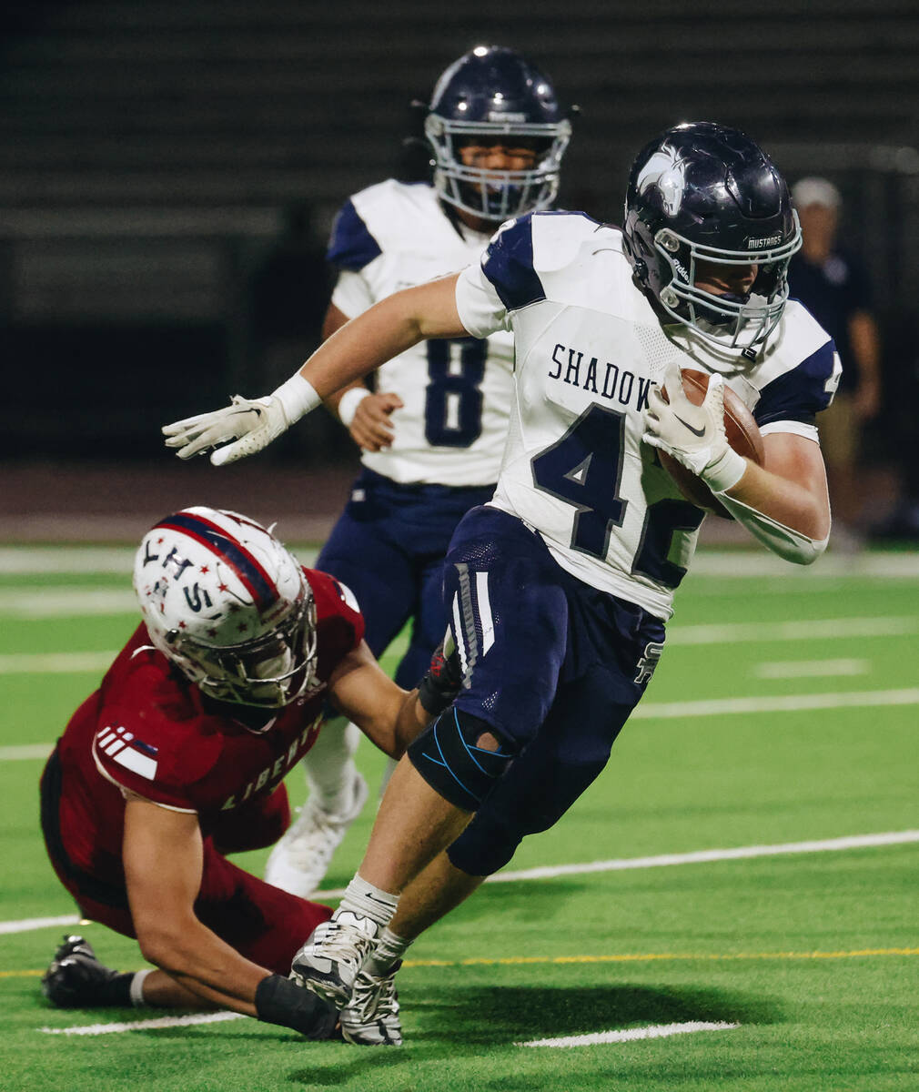 Shadow Ridge running back Evan Cannon (42) runs the ball during a game against Liberty at Liber ...