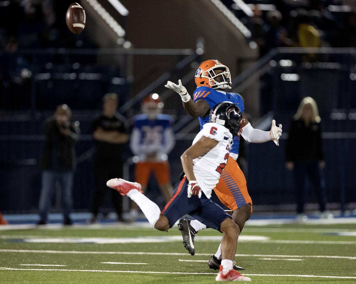 Coronado defensive back Jeremiah McQueen (21) knocks a pass away from Bishop Gorman tight end E ...