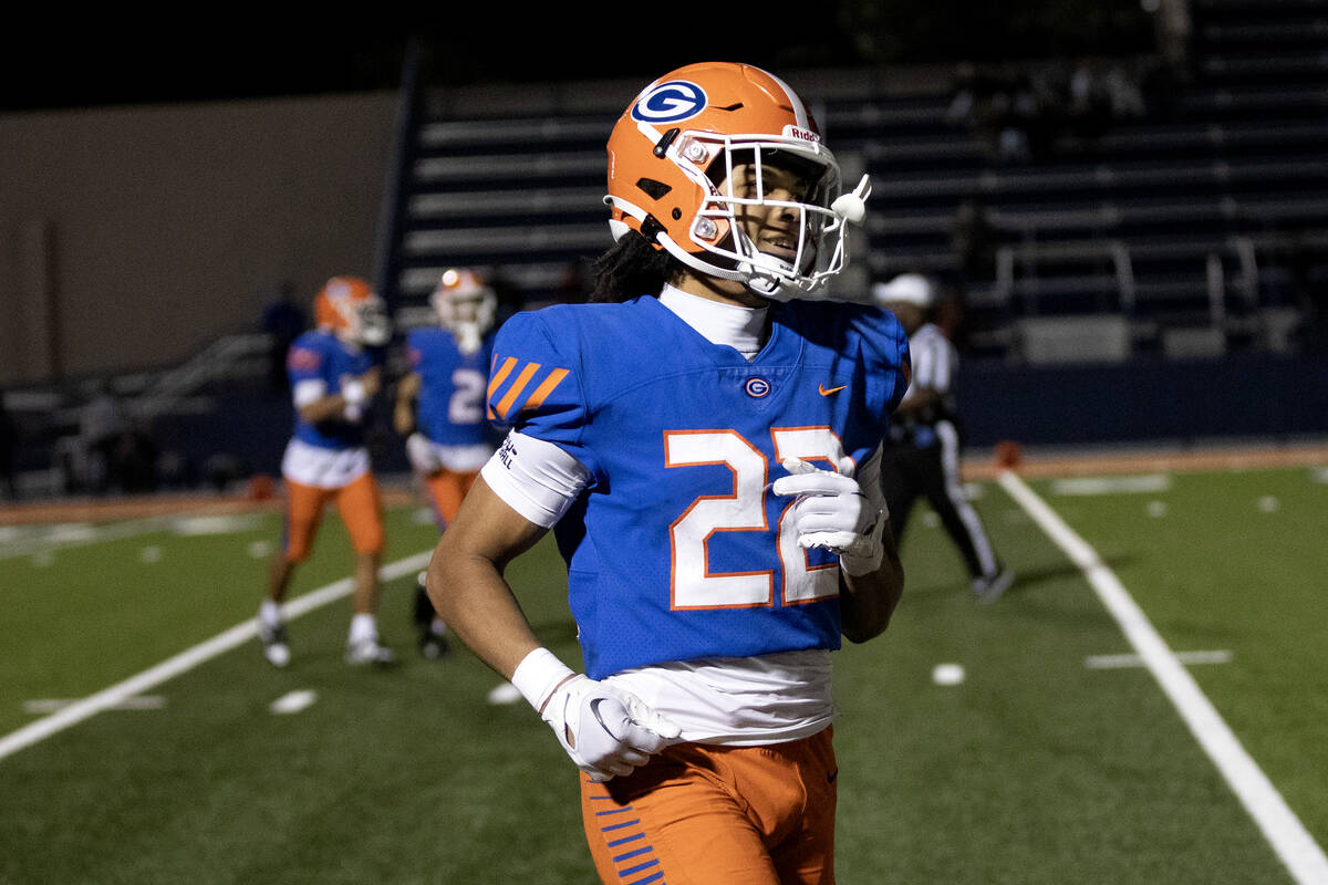 Bishop Gorman running back Micah Kaapana (22) runs toward the bench after scoring a touchdown d ...