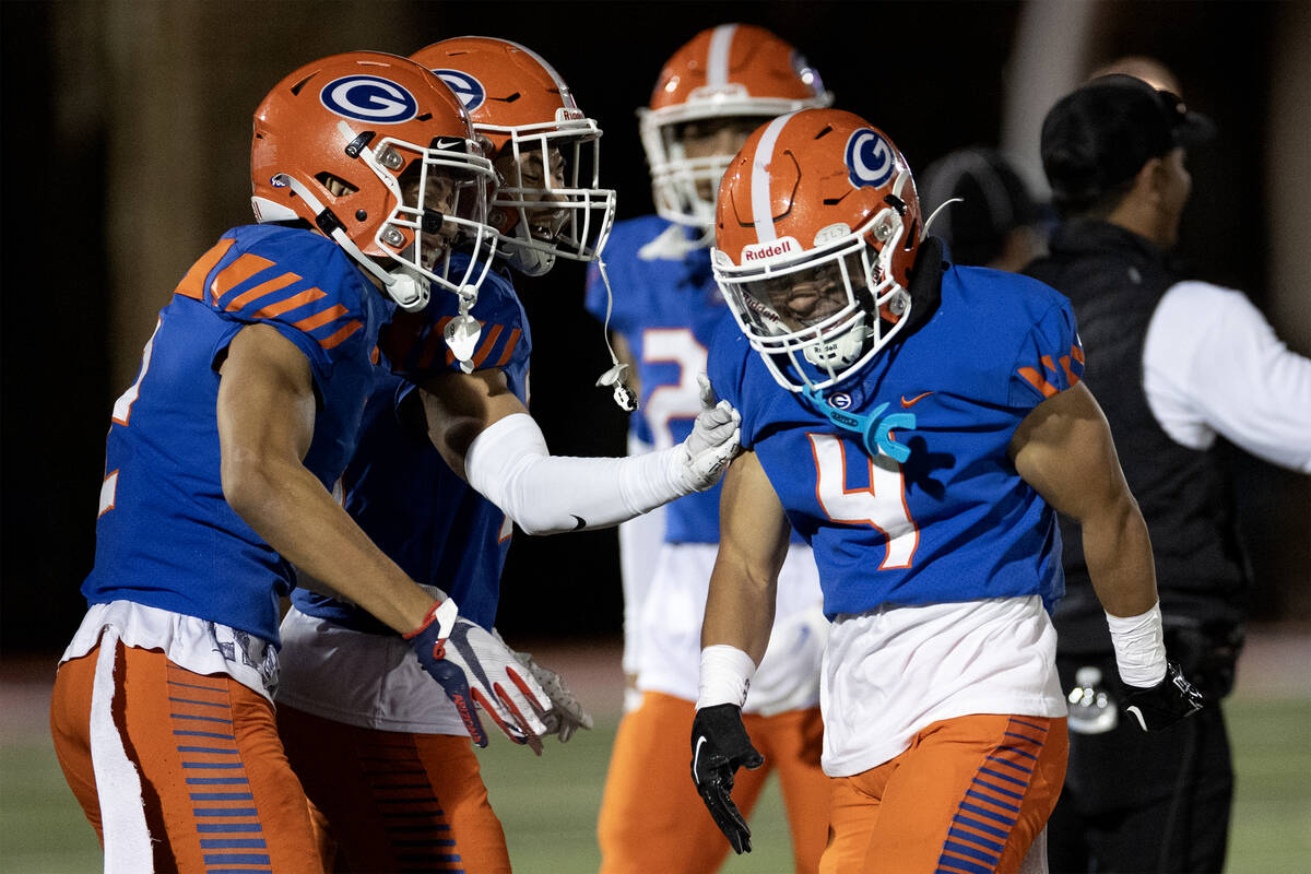 Bishop Gorman defensive back Zyzaiah Duncan (4) is congratulated after catching an interception ...