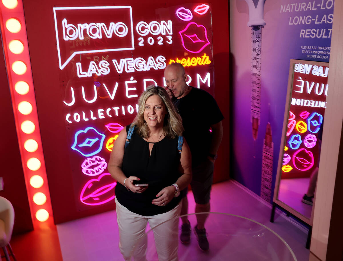 Valerie Orr and her husband Brent of Detroit check out a photo booth at BravoCon 2023 conventio ...