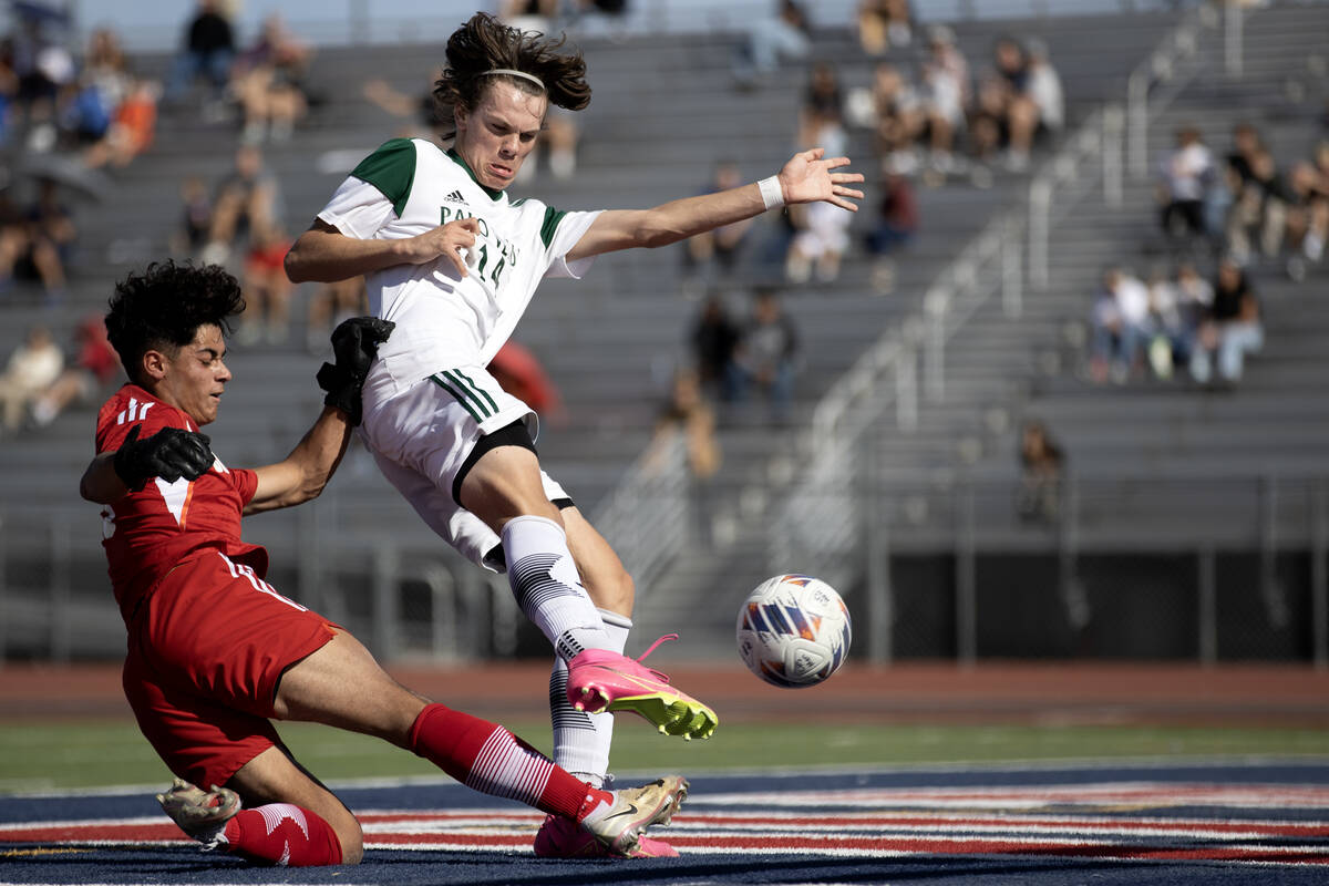 Palo Verde forward Evan Odle (14) kicks to score a goal against Coronado goaltender Logan Pierc ...