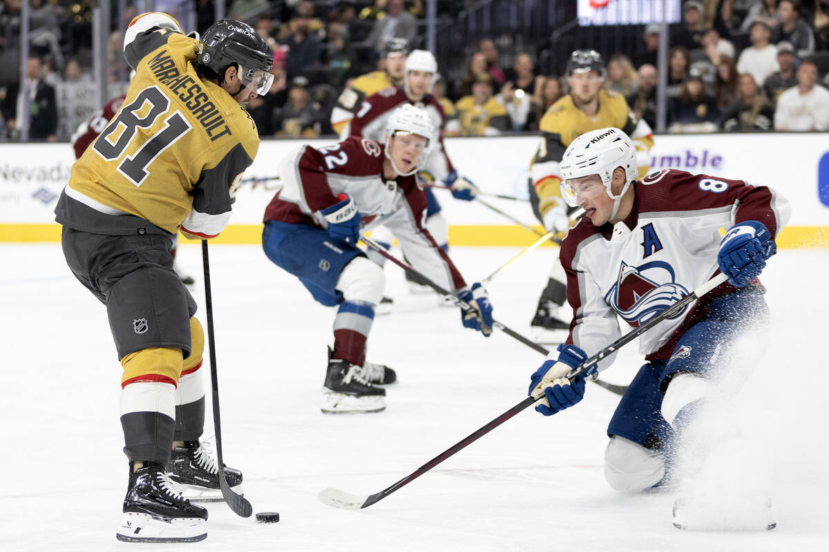 Golden Knights right wing Jonathan Marchessault (81) battles for the puck against Avalanche def ...