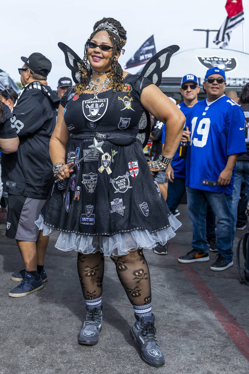 Tinkerhell strikes a pose in the tailgating area before the start of the Raiders against the Ne ...