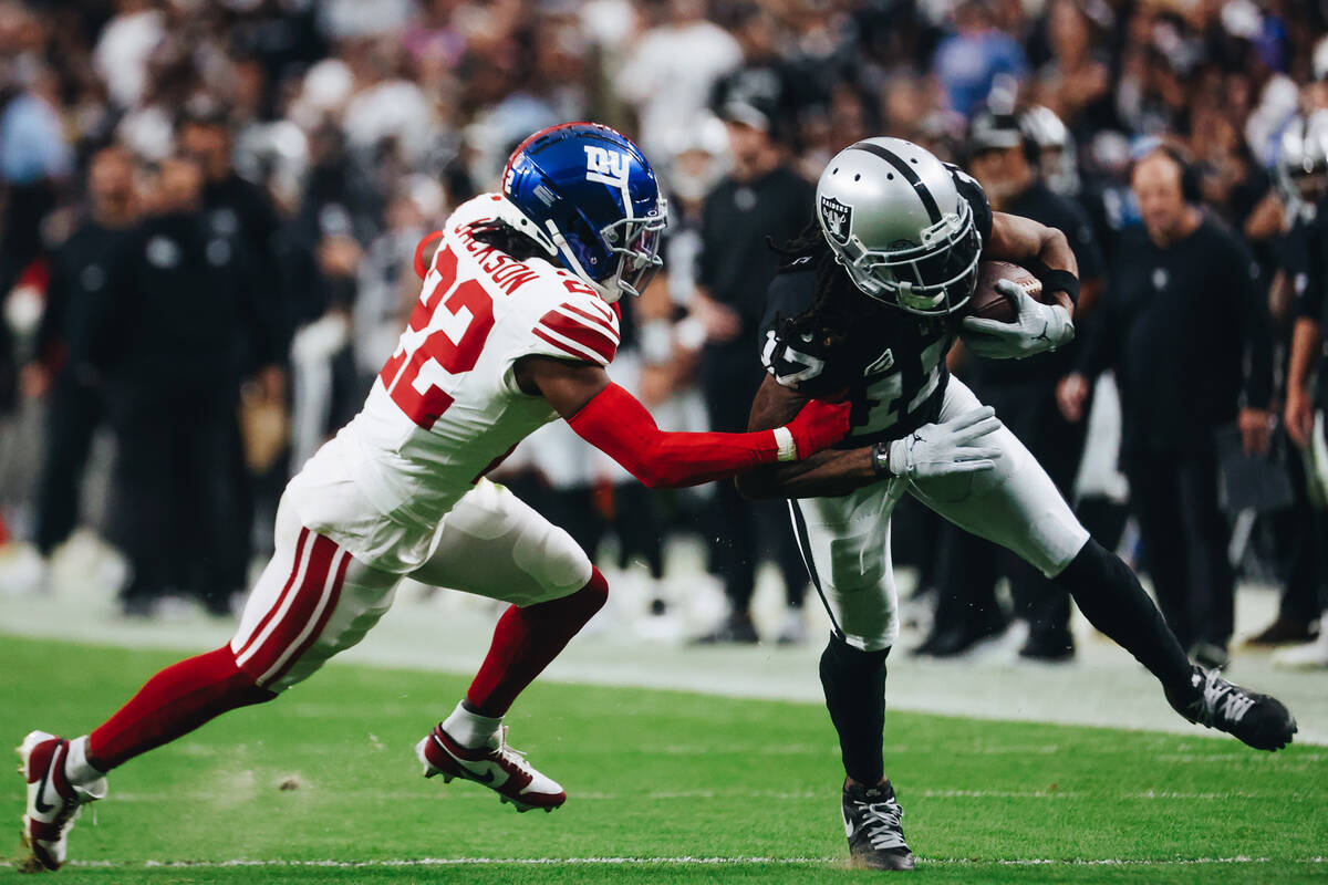Raiders wide receiver Davante Adams (17) runs the ball towards the end zone as New York Giants ...