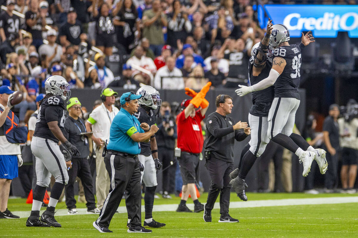 Vegas Raiders defensive end Maxx Crosby (98) celebrates a turnover with teammates against the N ...