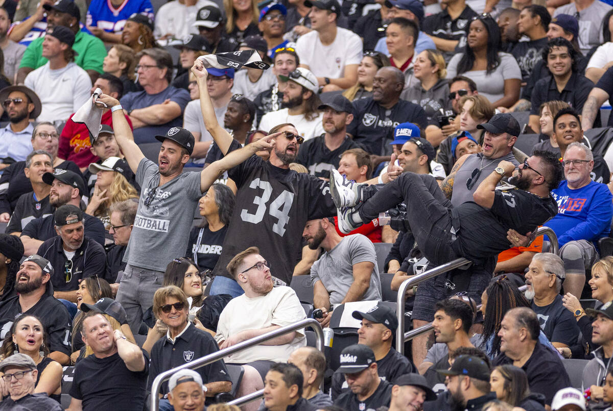 Raiders fans have fun in the stands against the New York Giants during the first half of their ...