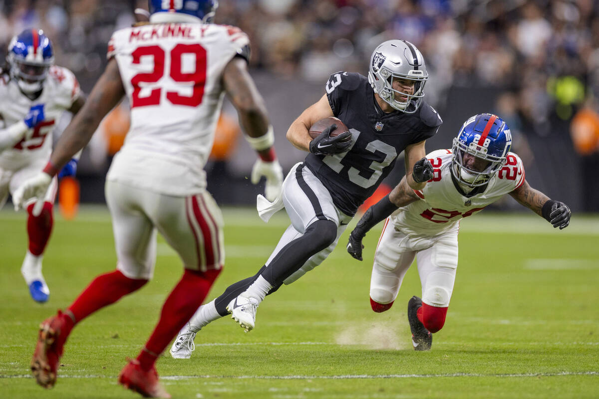 Raiders wide receiver Hunter Renfrow (13) looks for the end zone as New York Giants cornerback ...