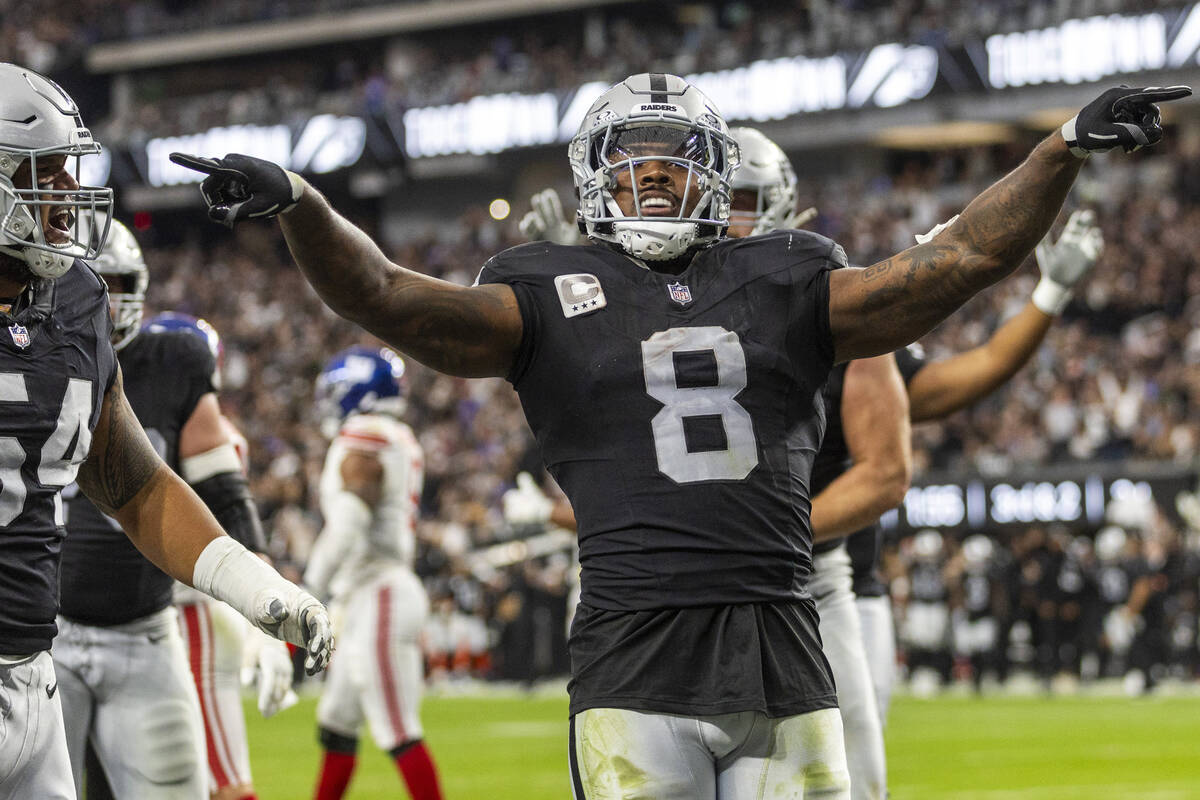 Vegas Raiders running back Josh Jacobs (8) celebrates a score against the New York Giants durin ...
