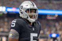 Raiders linebacker Divine Deablo (5) warms up on the field before an NFL game between the Raide ...