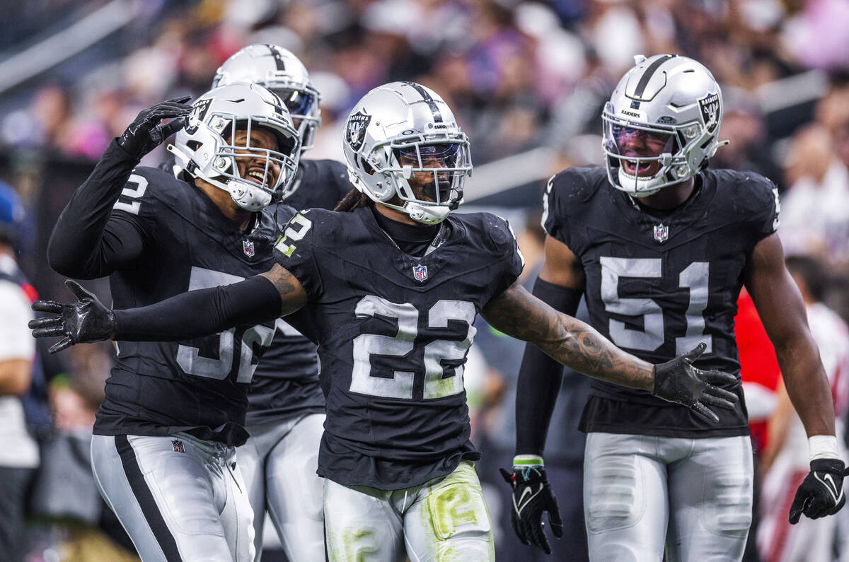Vegas Raiders running back Ameer Abdullah (22) and teammates celebrate a big tackle on a punt d ...