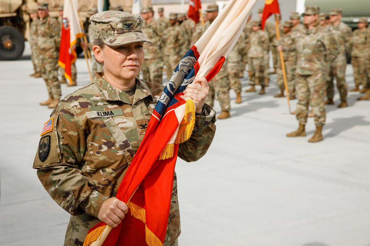 U.S. Army Col. Amy Klima holds the 17th Sustainment Brigade flag at Speedway Armory on Sunday, ...