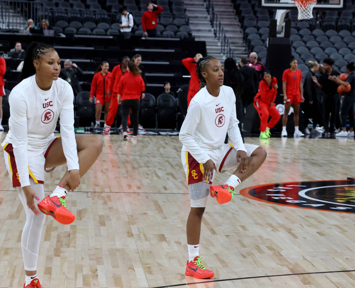 Spring Valley High basketball star Aaliyah Gayles, right, warms up with her USC teammates befor ...