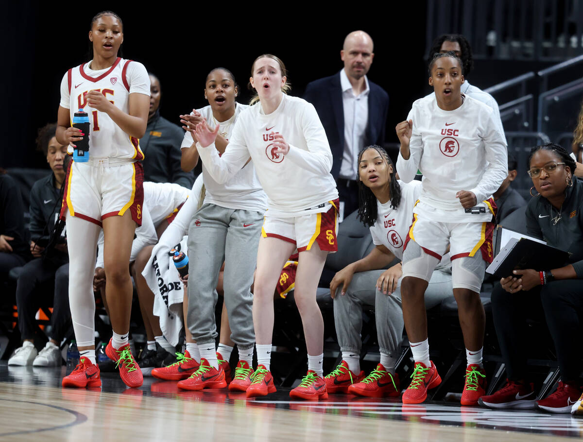 Former Spring Valley High basketball star Aaliyah Gayles, right, cheers with her USC teammates ...