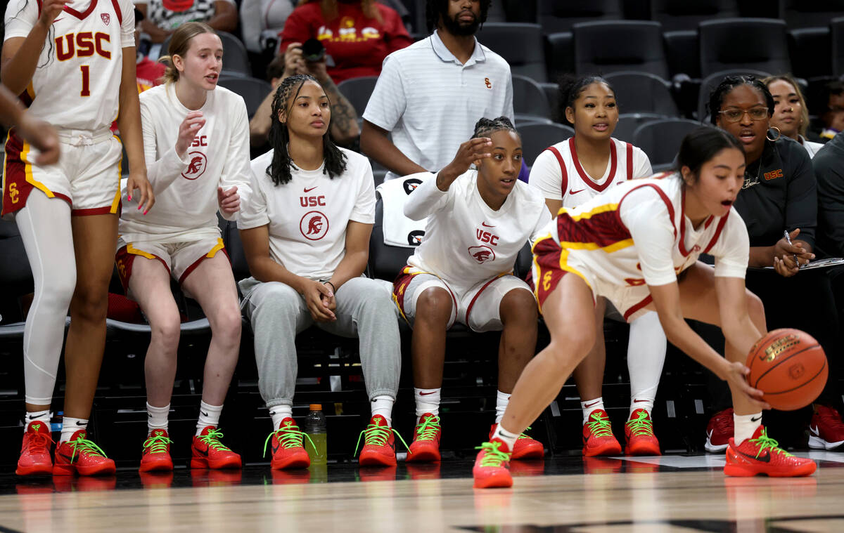 Former Spring Valley High basketball star Aaliyah Gayles, seated second from right, watches wit ...