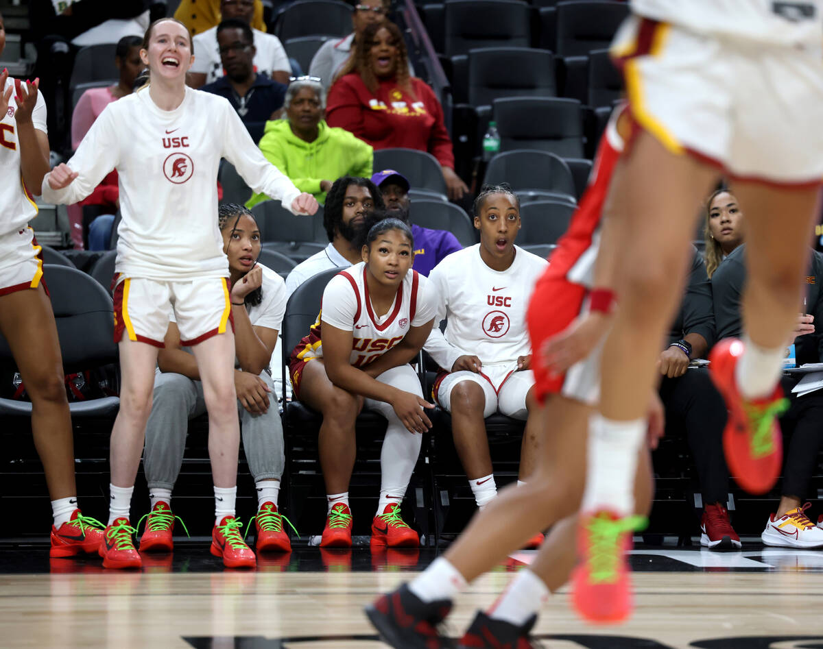 Former Spring Valley High basketball star Aaliyah Gayles, seated right, watches with her USC te ...