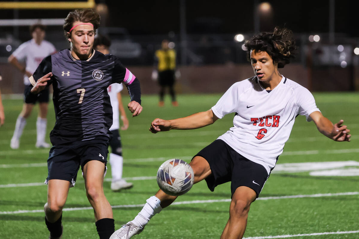 Southeast Career Technical Academy’s Nikko Rendon (6) kicks the ball away from Faith Lut ...