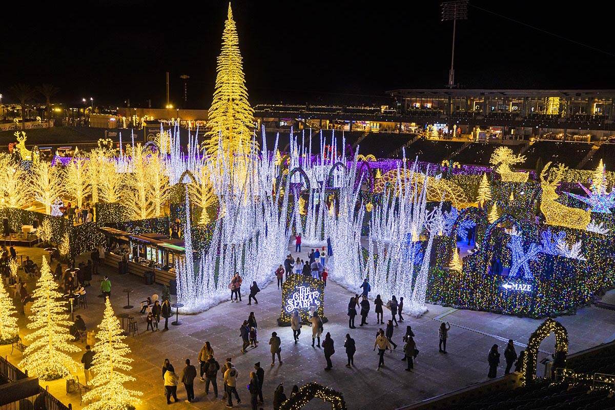 Visitors explore Enchant Christmas at Las Vegas Ballpark in 2021 in Las Vegas. (Benjamin Hager/ ...