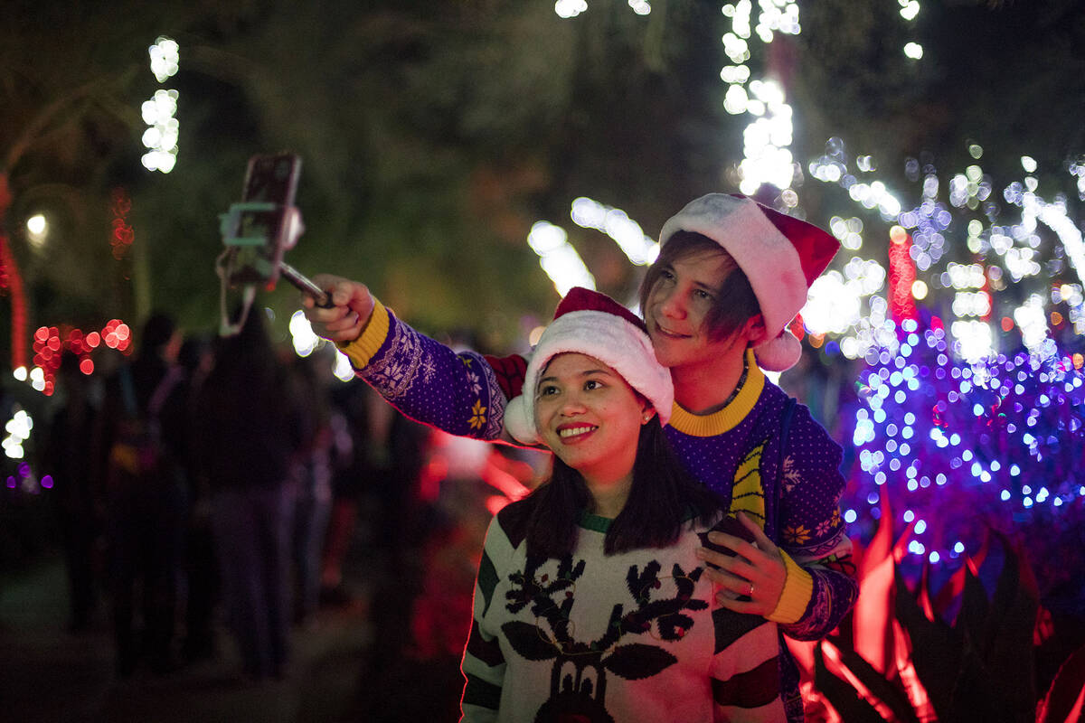 Dylan Rahilly takes a selfie with his wife Heaven Magno at the Ethel M Chocolates cactus garden ...