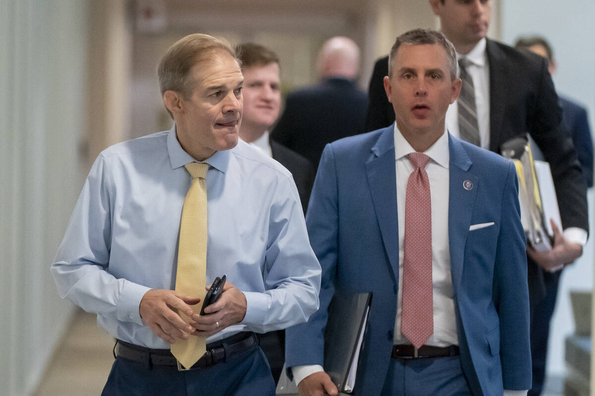 Rep. Jim Jordan, R-Ohio, left, arrives to hear from U.S. Attorney David Weiss in an interview b ...