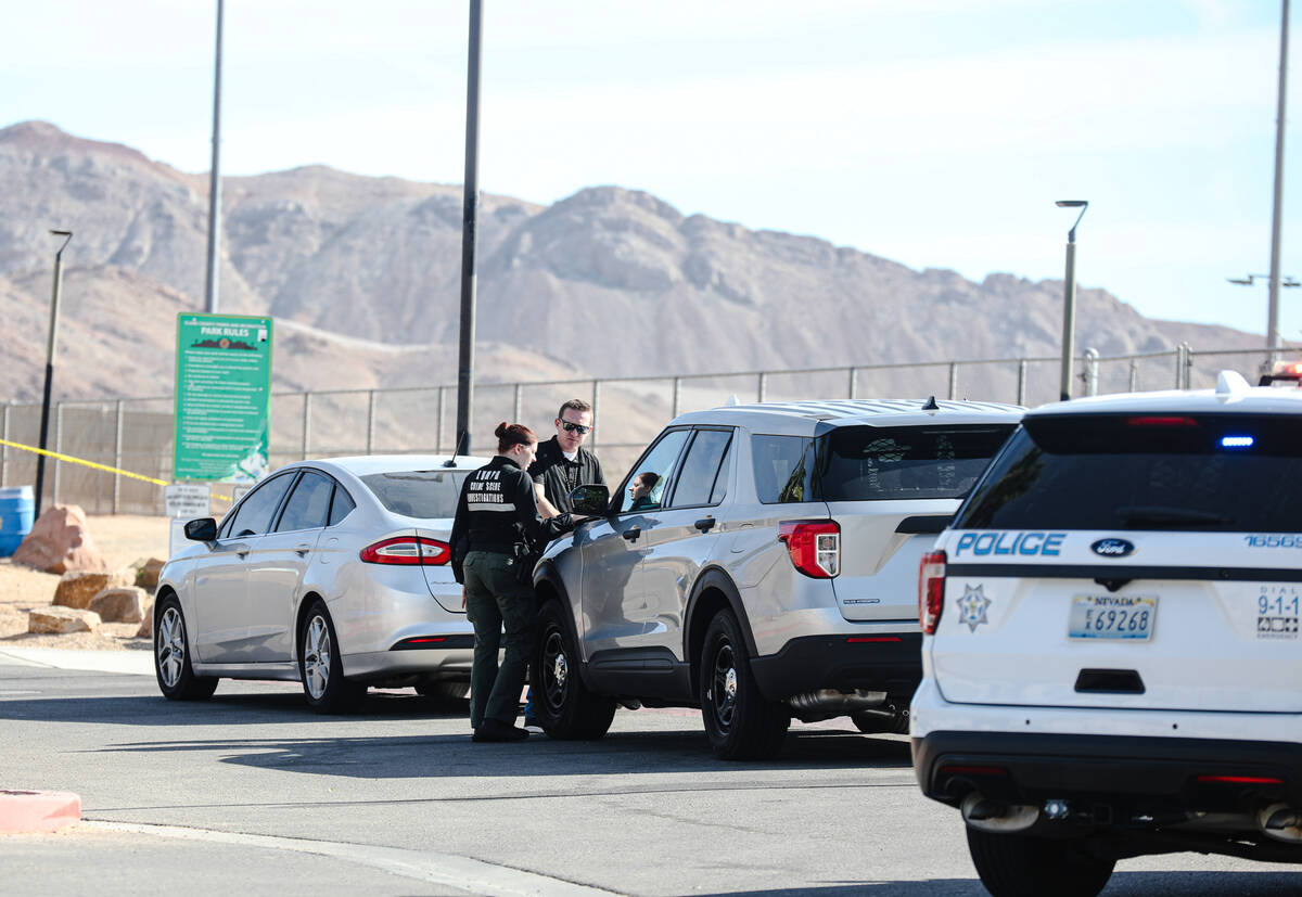 Police investigate a dead body found on the shared-use athletic fields between Harney Middle Sc ...
