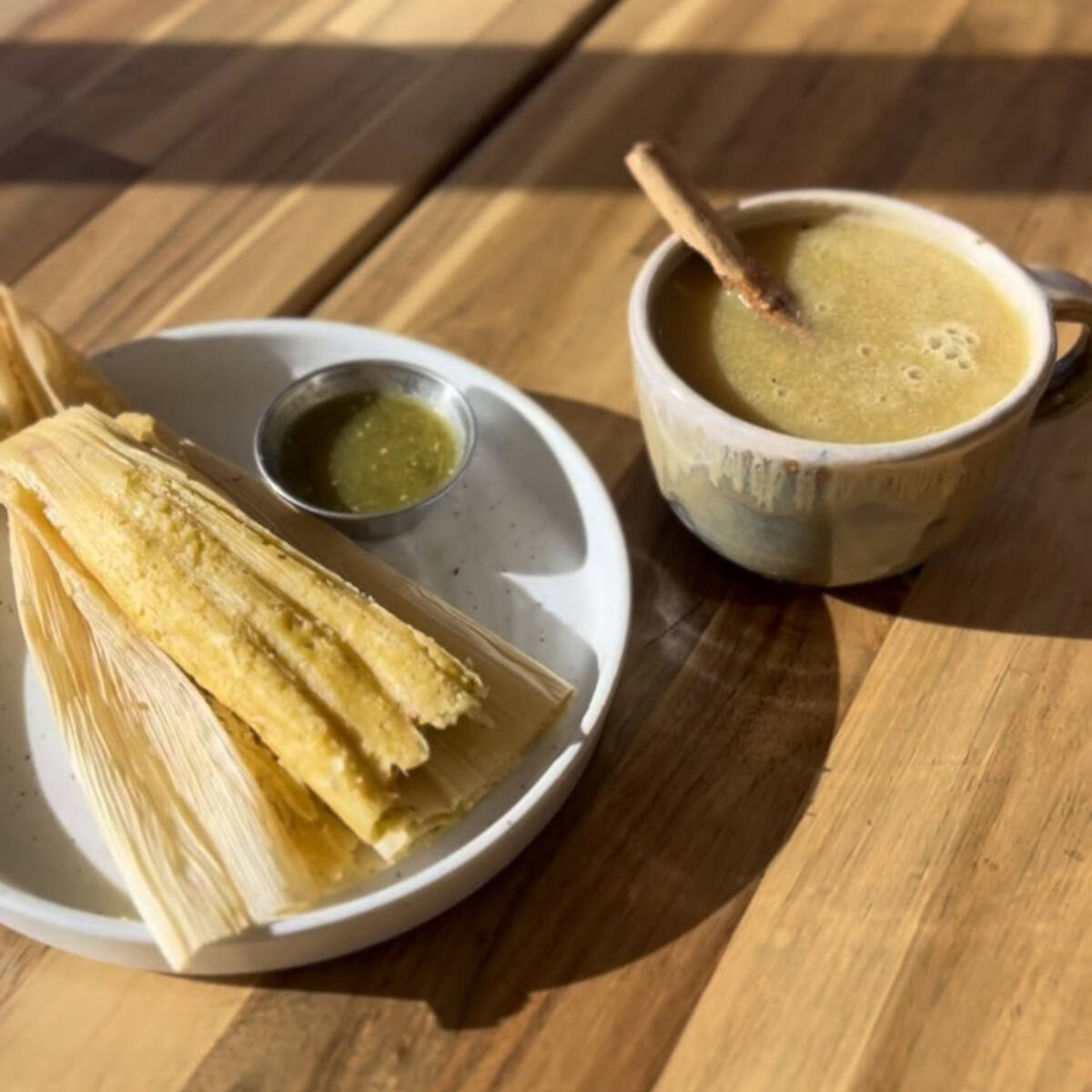 Tamales fashioned with housemade masa and atole hot corn drink are two holiday specials offered ...