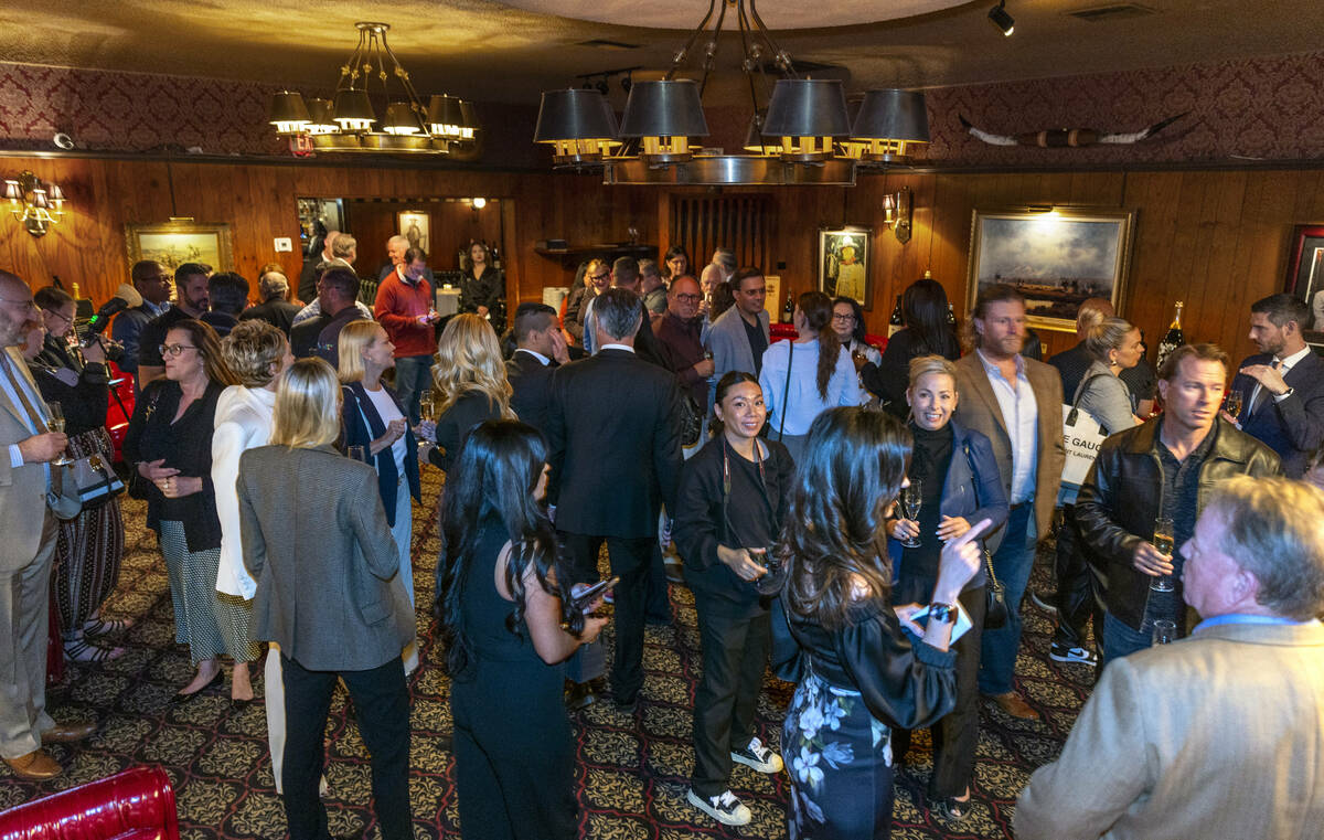 Guests mingle during an event to celebrate the first expansion in nearly 50 years at the Golden ...