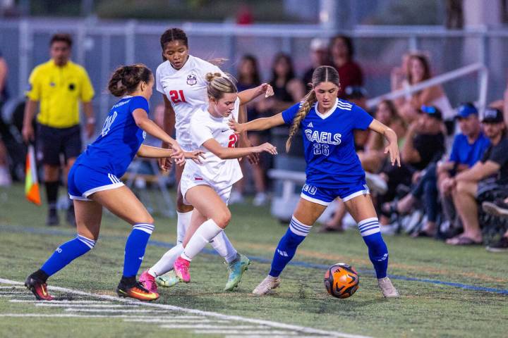 Coronado forward Aubrey Wagner (24) battles for the ball with Bishop Gorman's Tatum Manley (26) ...