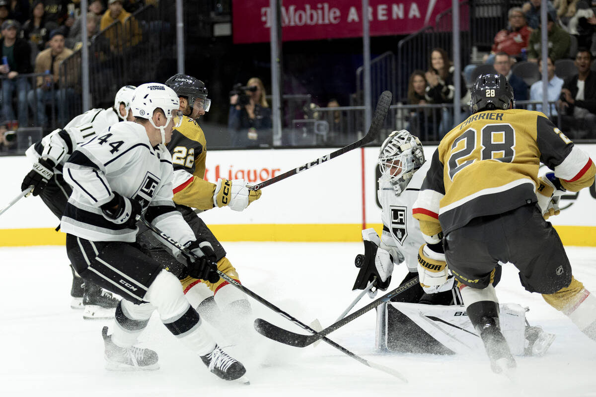 Kings goaltender Cam Talbot (39) saves the puck after Golden Knights right wing Michael Amadio ...