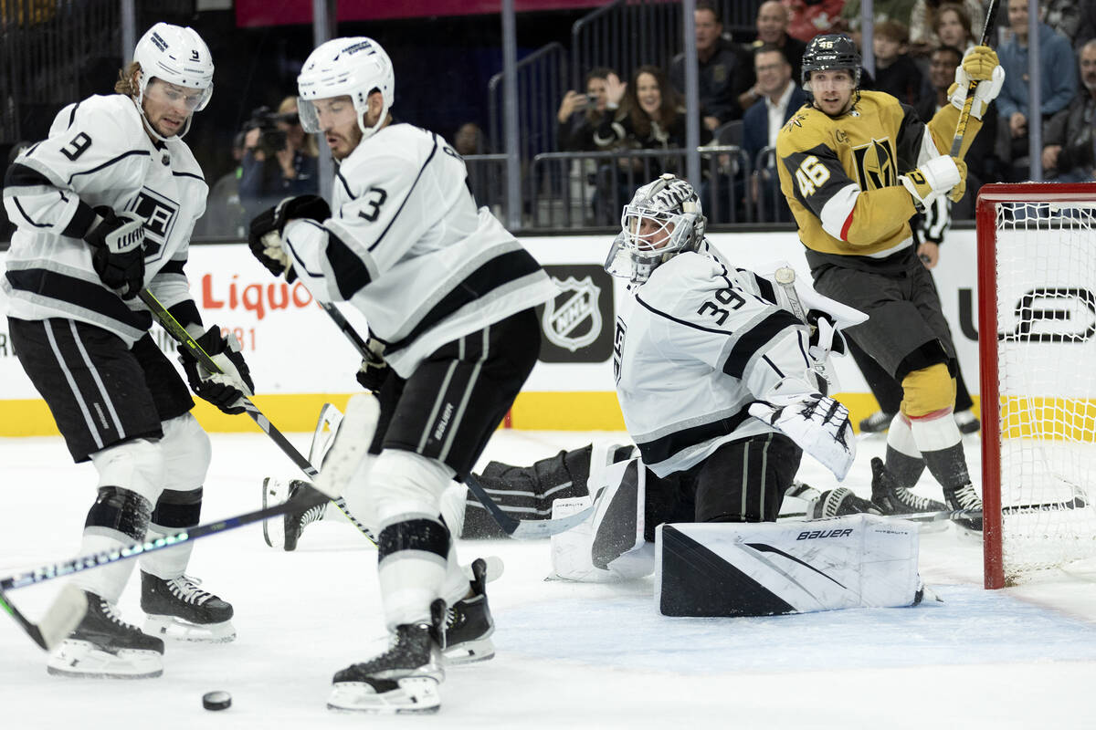 Kings goaltender Cam Talbot (39) saves the puck after Golden Knights right wing Jonas Rondbjerg ...