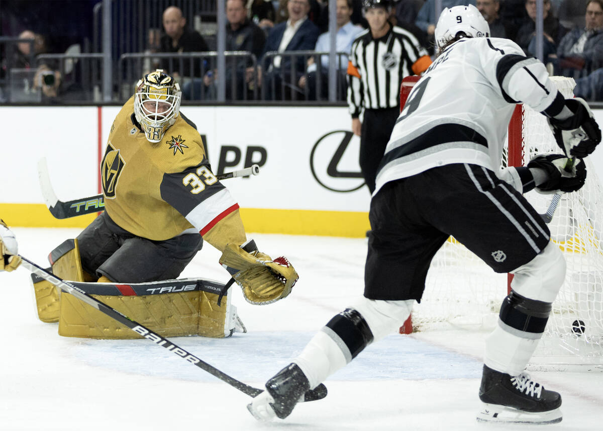 Golden Knights goaltender Adin Hill (33) misses the save on a goal scored by Kings center Adria ...