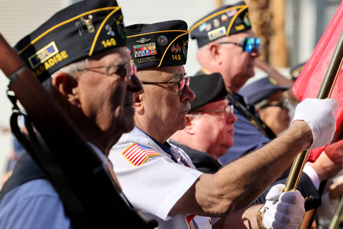 American Legion Paradise Post 149 members march in the Veterans Day parade on Fourth Street in ...