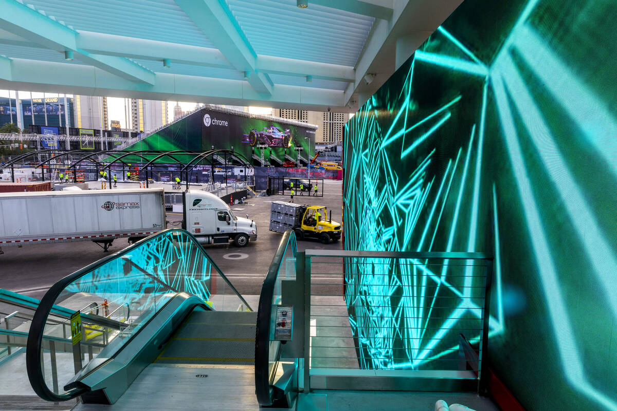 The entrance area is illuminated with light panels as construction continues outside and within ...