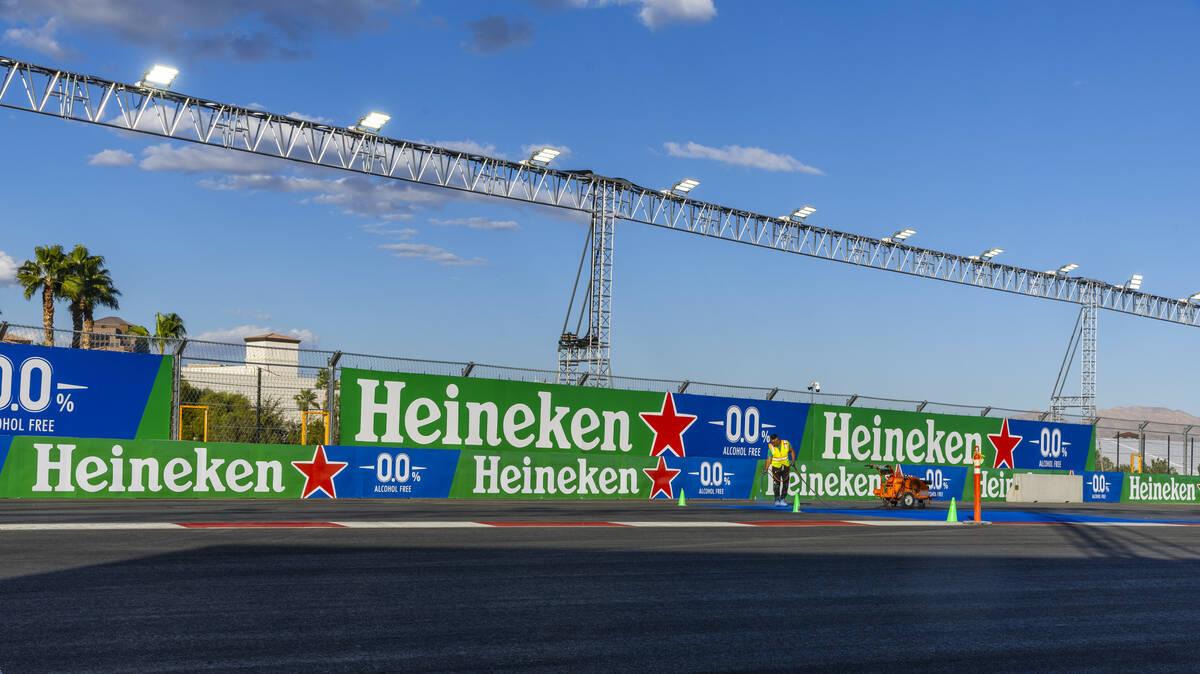 Turn one is painted with a logo about the Formula One Las Vegas Grand Prix pit building during ...