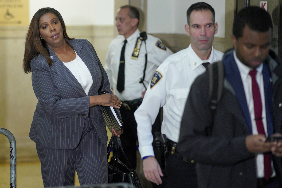 New York Attorney General Letitia James, center, walks out of the courtroom after former Presid ...
