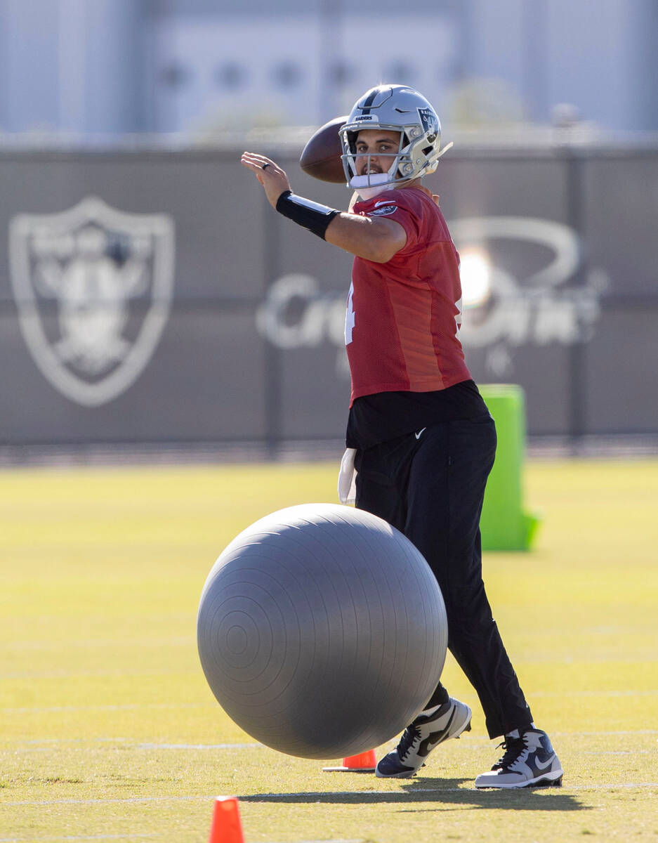 Raiders quarterback Aidan O'Connell (4) works through drills during practice at the Intermounta ...