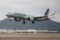 An airplane flies into Harry Reid International Airport on Saturday, August 19, 2023, in Las Ve ...