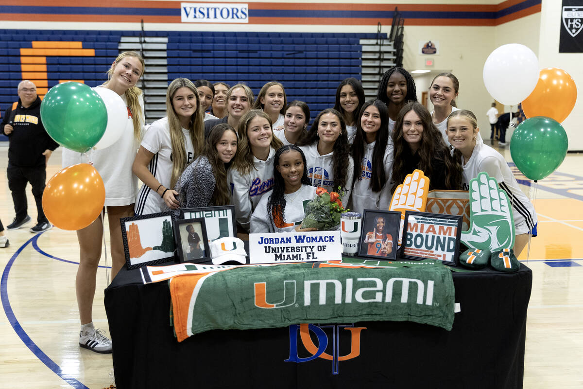 The Bishop Gorman varsity girls soccer team surrounds their teammate Jordan Womack, who will pl ...