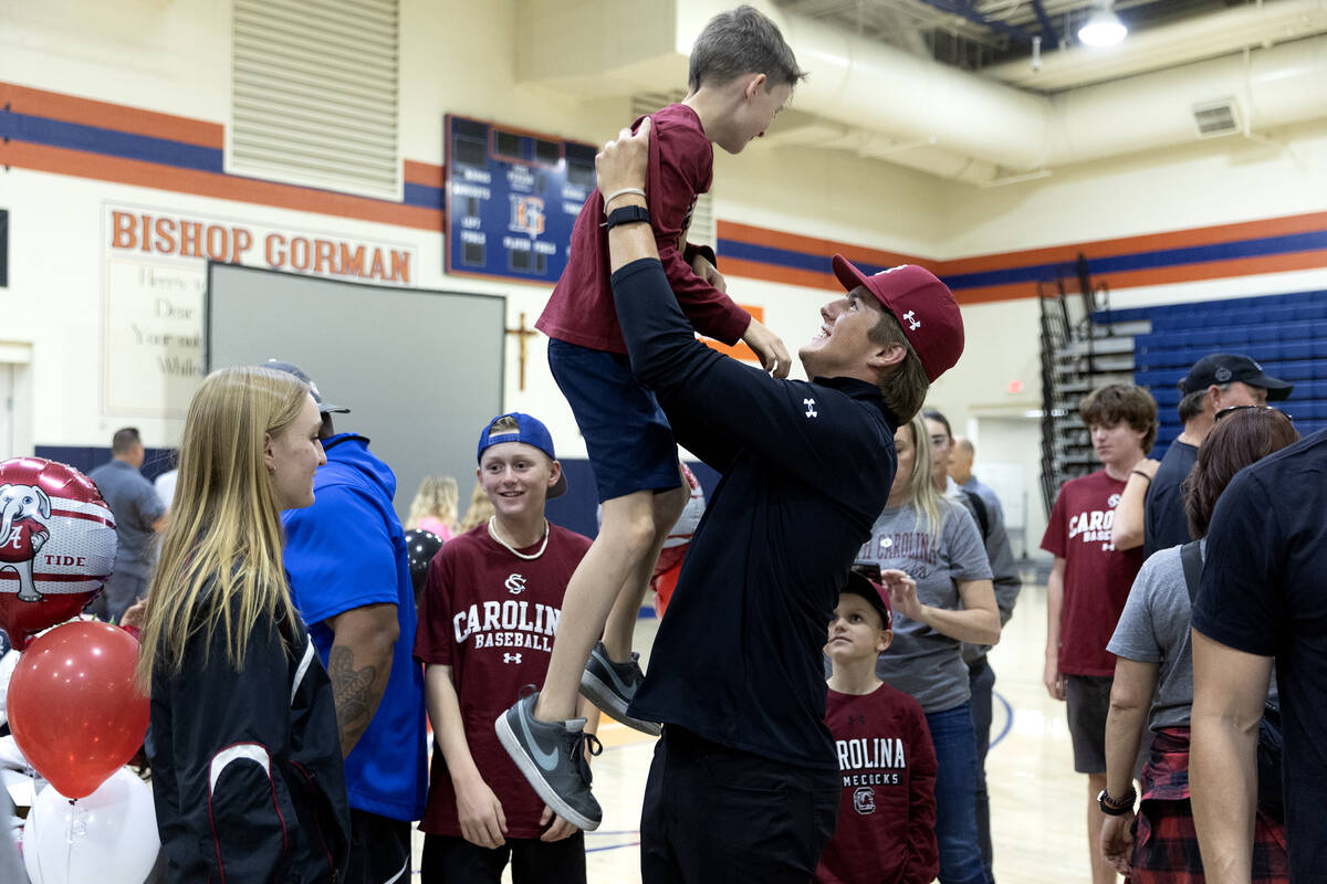 Henry Prindl lifts his cousin Brayden Waters after signing his national letter of intent to pla ...