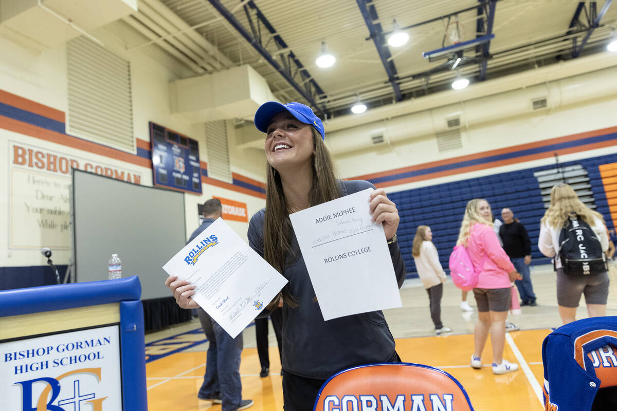 Lacrosse player Addie McPhee smiles with her national letter of intent to play at Rollins Colle ...