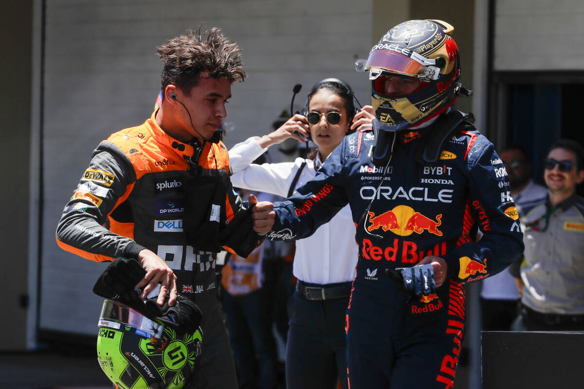 Red Bull driver Max Verstappen of the Netherlands, right, congratulates McLaren driver Lando No ...