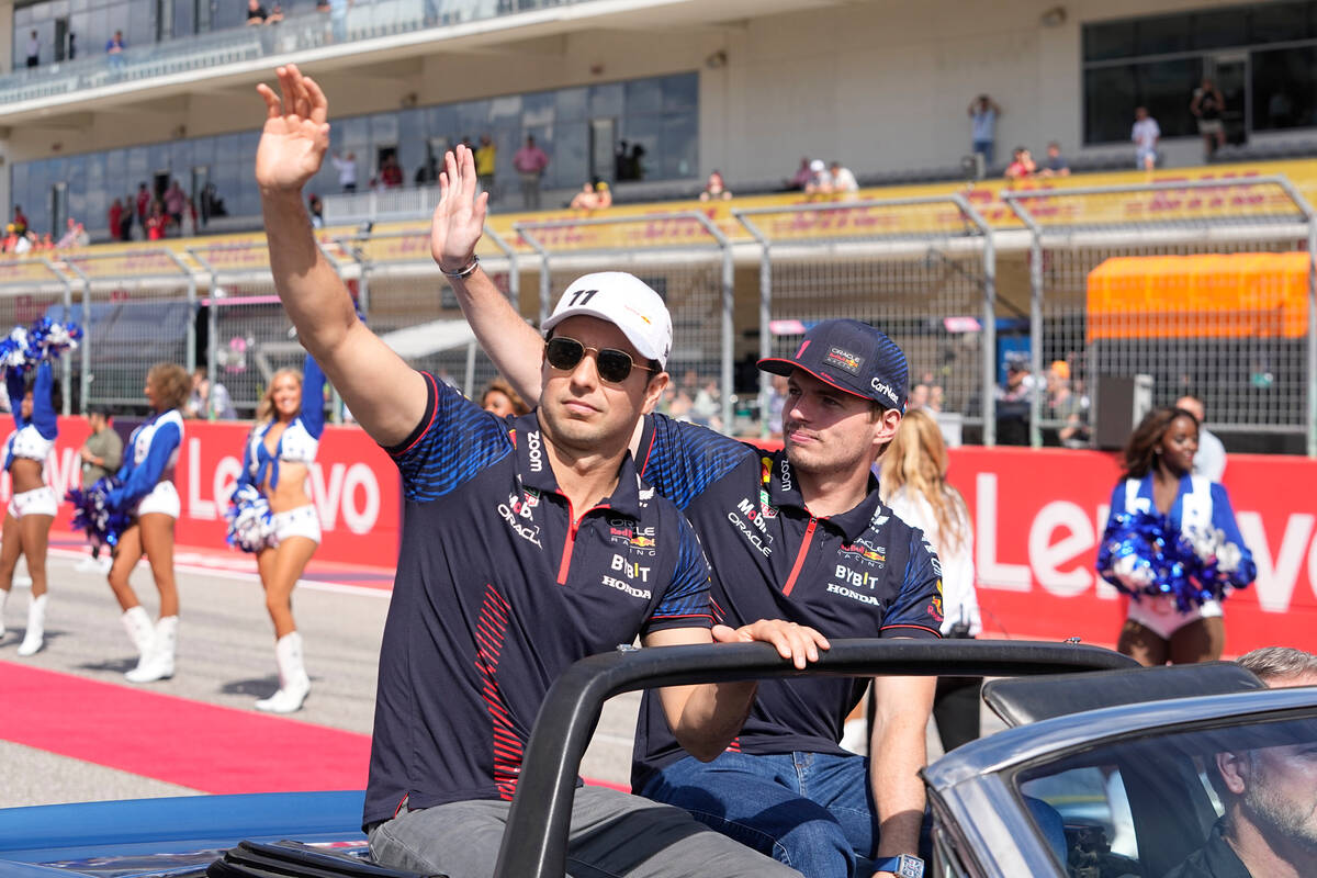 Red Bull driver Sergio Perez, of Mexico, left, and Red Bull driver Max Verstappen, of the Nethe ...